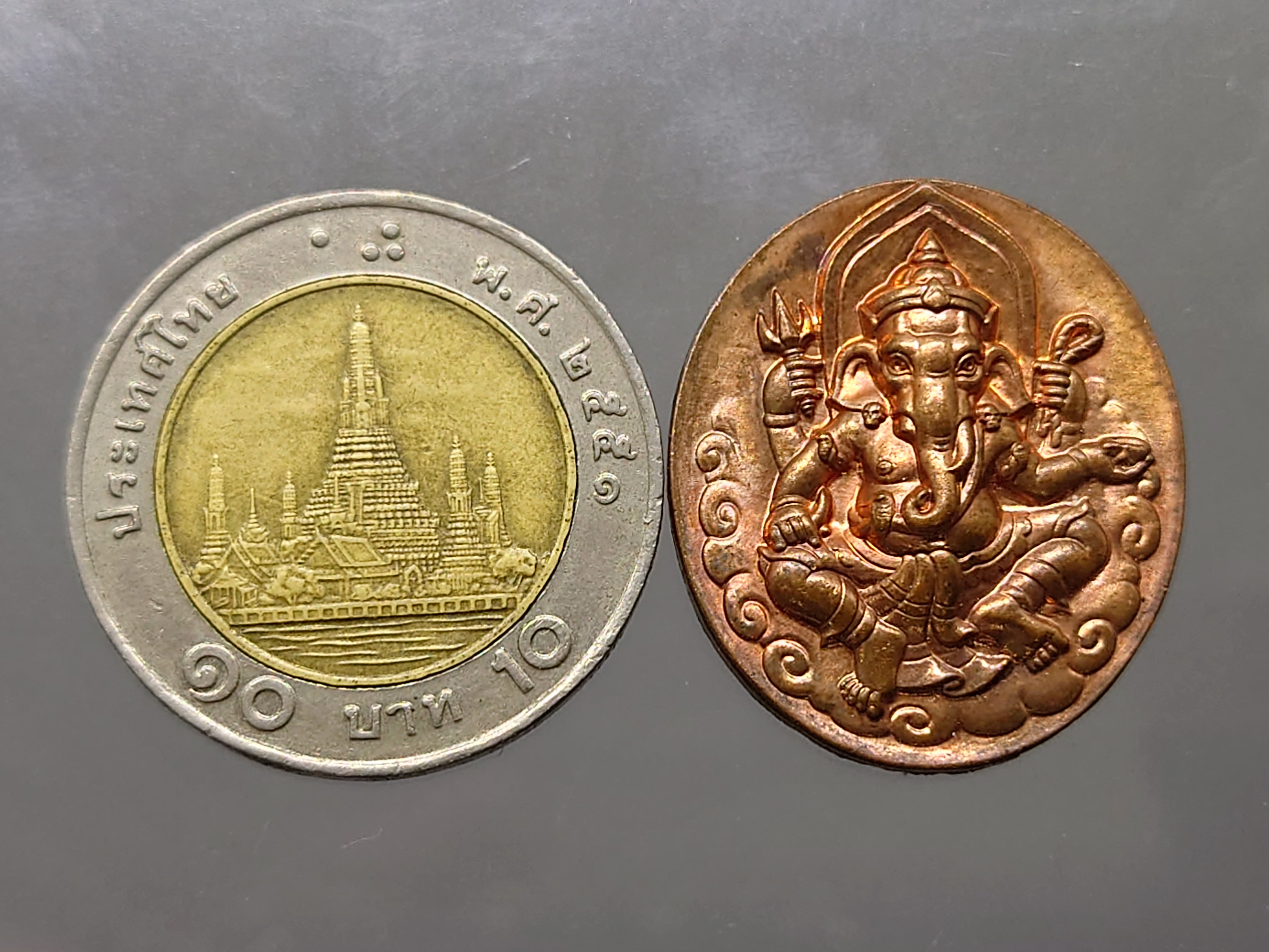 เหรียญพระพิฆเนศ หลังสัญลักษณ์โอม กรมศิลปากร ปี 2540 พร้อมกล่องไม้ กล่องขาว ใบคาถา หายาก