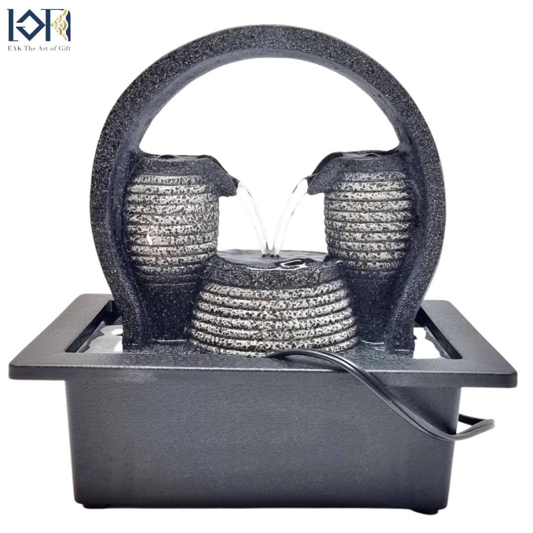 น้ำพุล้นตั้งโต๊ะ รุ่นสายน้ำแห่งโชคลาภ21025 เป็นรูปเหยือรินน้ำเข้าหากัน ให้ความหมายถึงเงินทองไหลริน