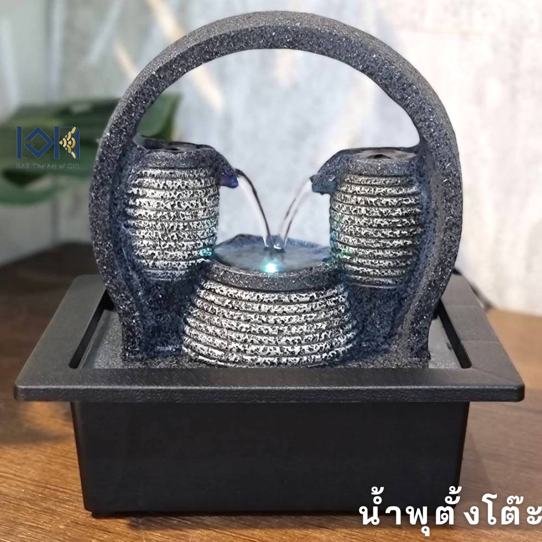 น้ำพุล้นตั้งโต๊ะ รุ่นสายน้ำแห่งโชคลาภ21025 เป็นรูปเหยือรินน้ำเข้าหากัน ให้ความหมายถึงเงินทองไหลริน