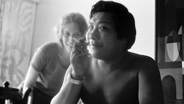 A person smoking a cigarette

Description automatically generated with medium confidence
