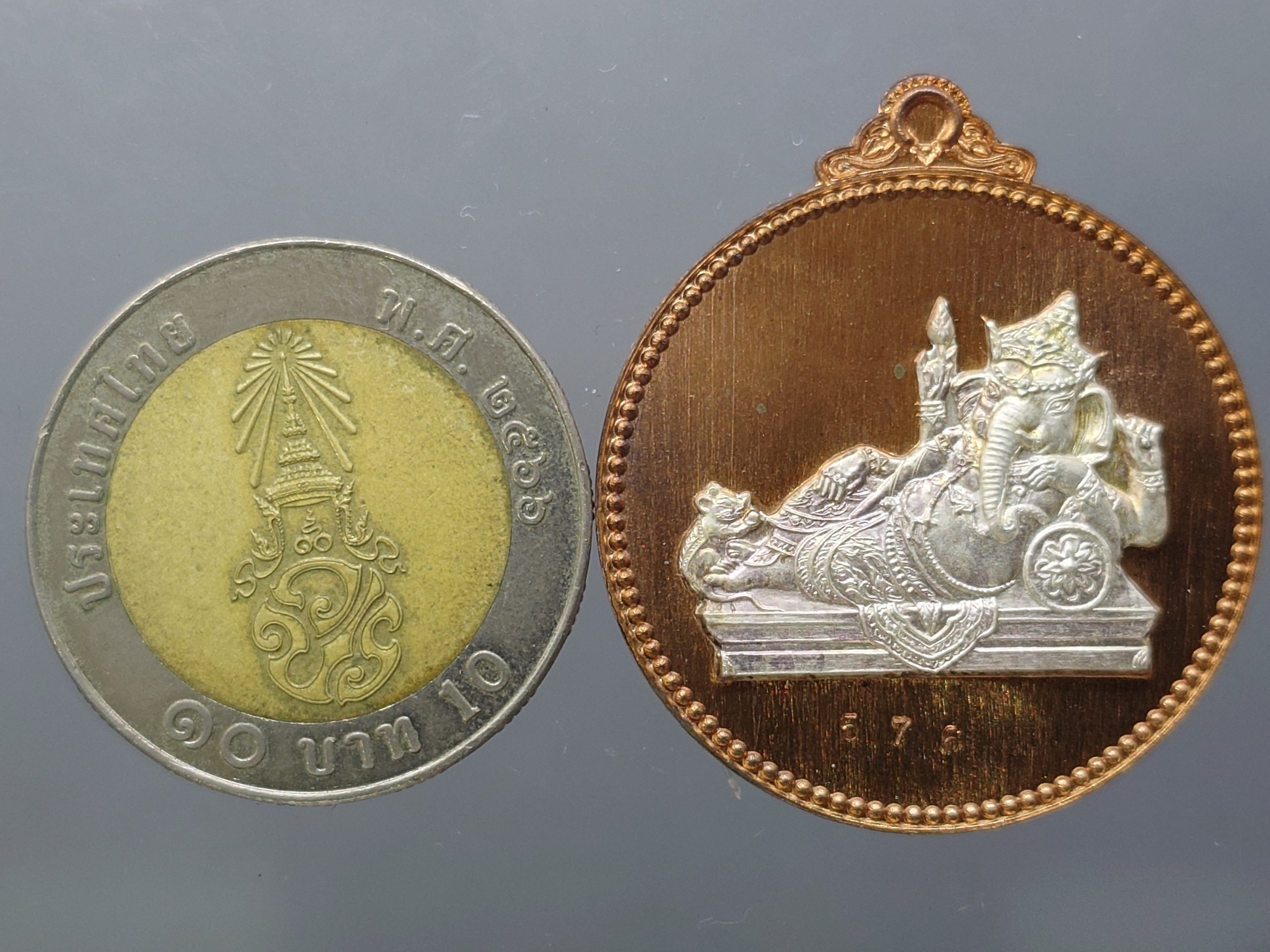 เหรียญพระพิฆเนศ "ไสยาสน์คเณศ" เนื้อนวะหน้ากากเงิน รุ่น เสวยสุข วัดสมานรัตนาราม ปี2559 พร้อมตลับเดิม